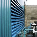 Chiller Noise Reduction by Machinery enclosure with inlet silencer and acoustic louvred doors for noise control.