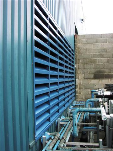 Chiller Noise Reduction by Machinery enclosure with inlet silencer and acoustic louvred doors for noise control.
